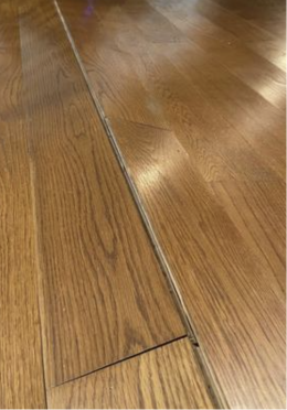 Living room water damage to wood floors